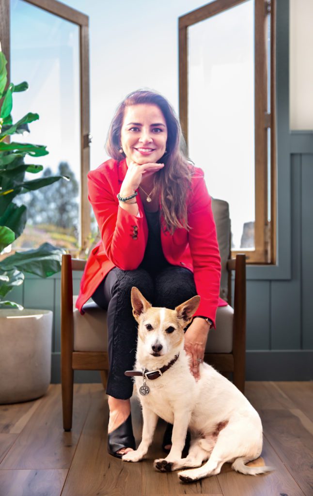 Female accountant in formal outfit with a dog - Coach Agustina Lyman